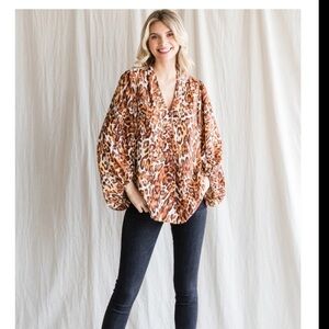 Leopard Print Top with Black Jeans and White Boots